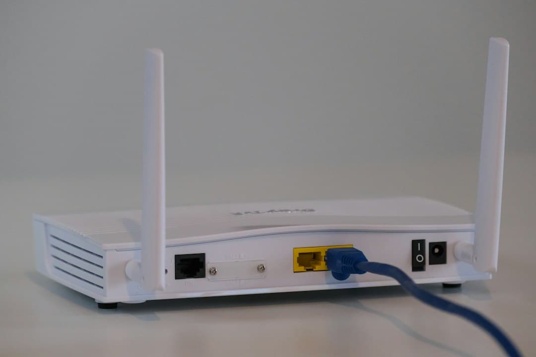 Home Wi-Fi router with an Ethernet cable plugged in, checking the connection when Zyminex IPTV is not working