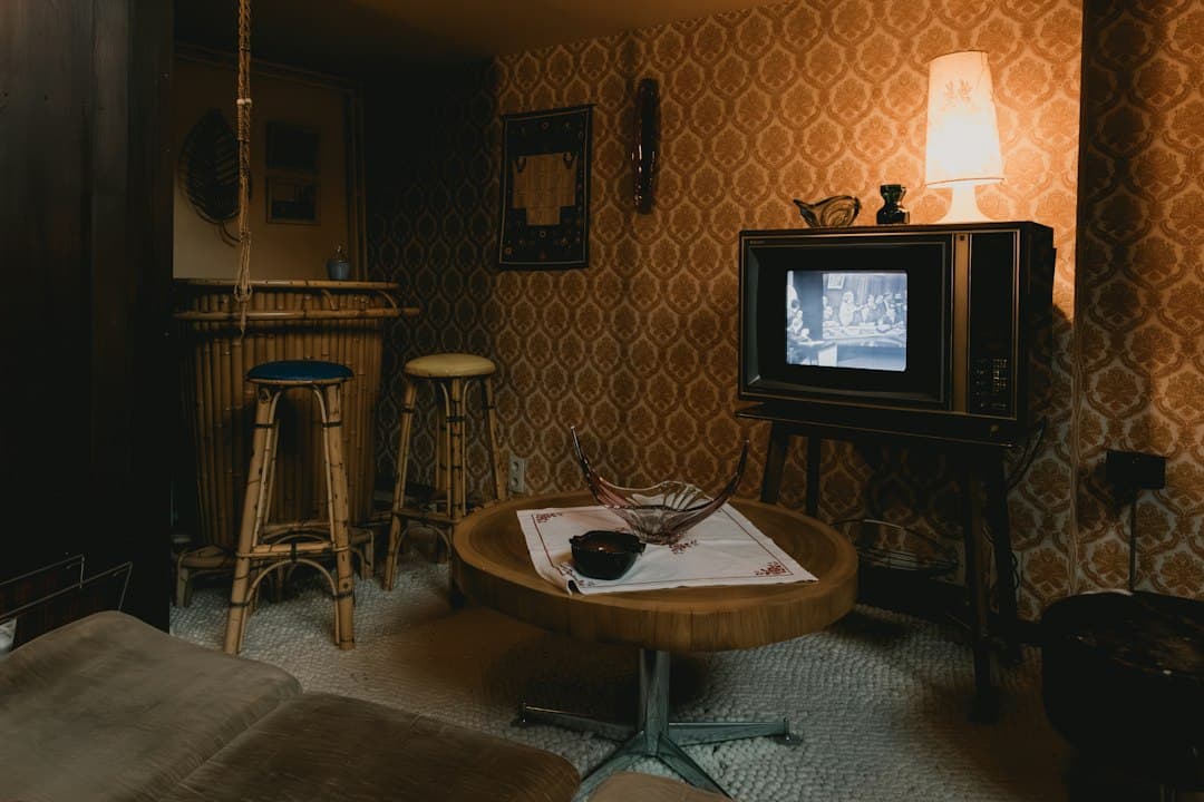 Living room at night with a lamp and a TV on a stand, watching Zyminex IPTV in the USA